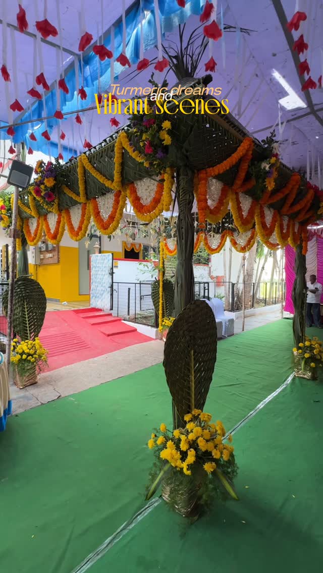 Traditional haldi décor with palm leaves and marigold flowers
